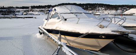 Boat covered in snow